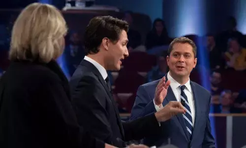 Canada PM Justin Trudeau dukes it out with Tory rival over climate, election timing