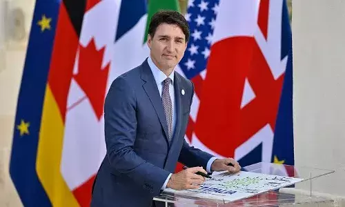 Canada PM Justin Trudeau dukes it out with Tory rival over climate, election timing